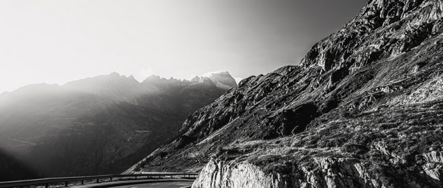 Bild In balance, a mountain pass road in the swiss alps